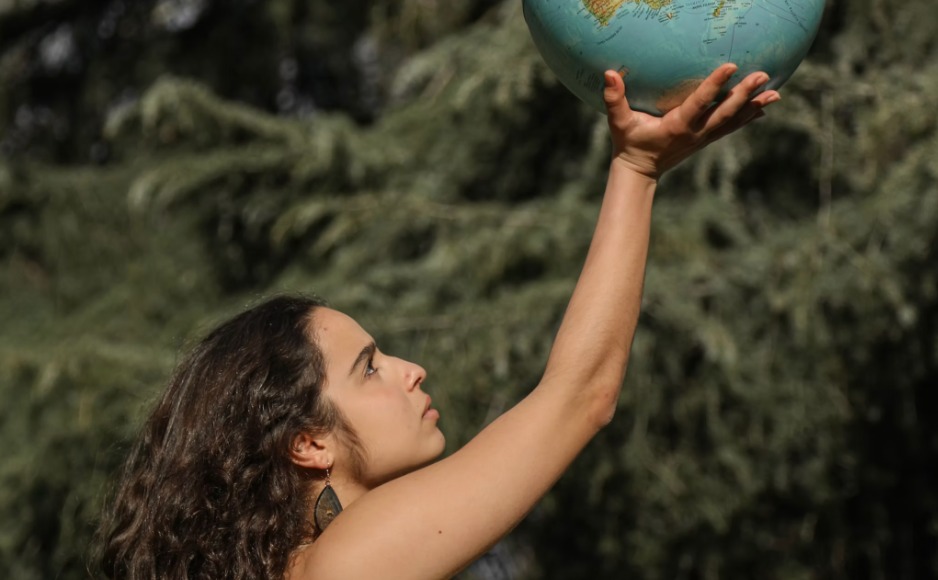 Woman holding a globe